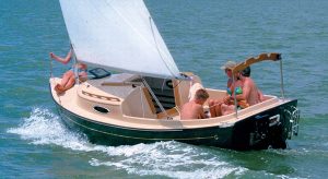 family sailing on a compac yacht