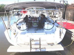 happy owners sitting at helm