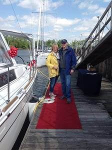 new owners posing on dock
