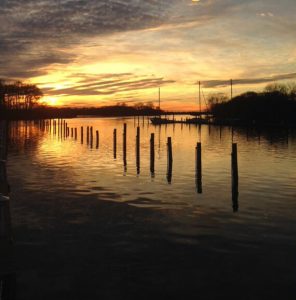 dock pilings at sunset