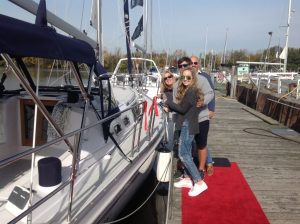 happy owners posing on dock