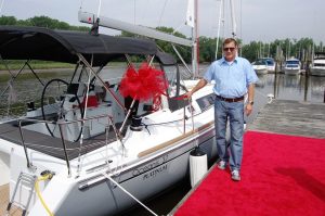 happy owner posing with boat